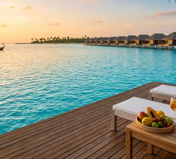 Resort de luxe aux Maldives avec bungalow sur pilotis et mer turquoise cristalline